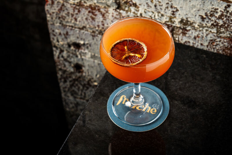 Branded Fraiche DC cocktail coupe with signature cocktail